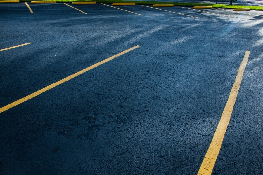 newly resurface asphalt parking lots